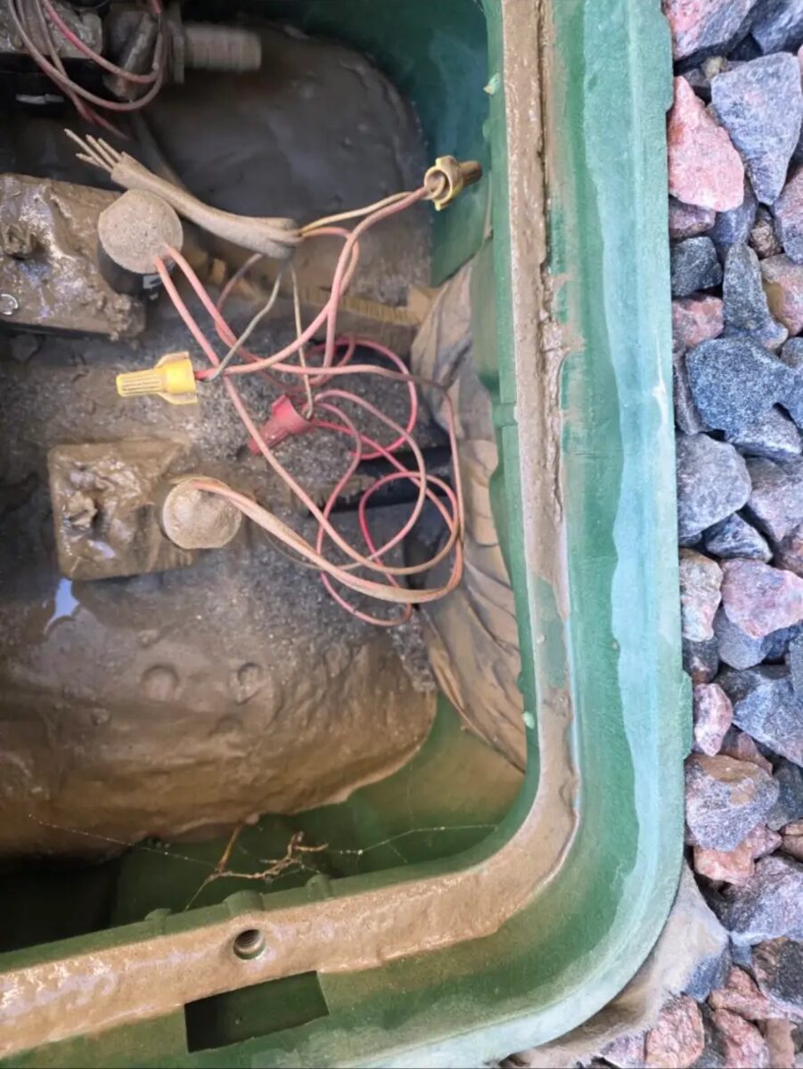 Silted-in valve box cleaned out and the wire nuts replaced with proper grease caps.