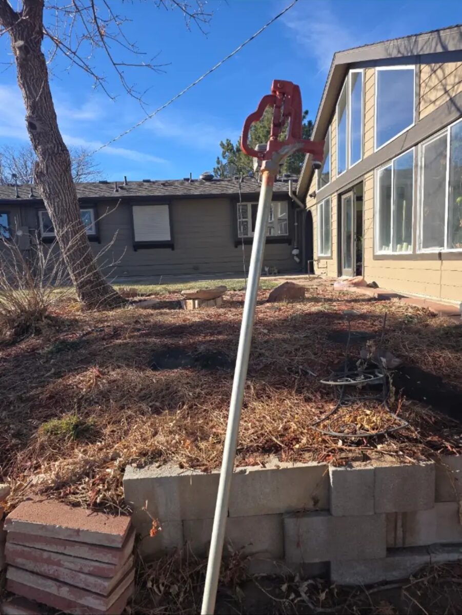 Impact head raised on a riser to clear a rough grade during a system rebuild.