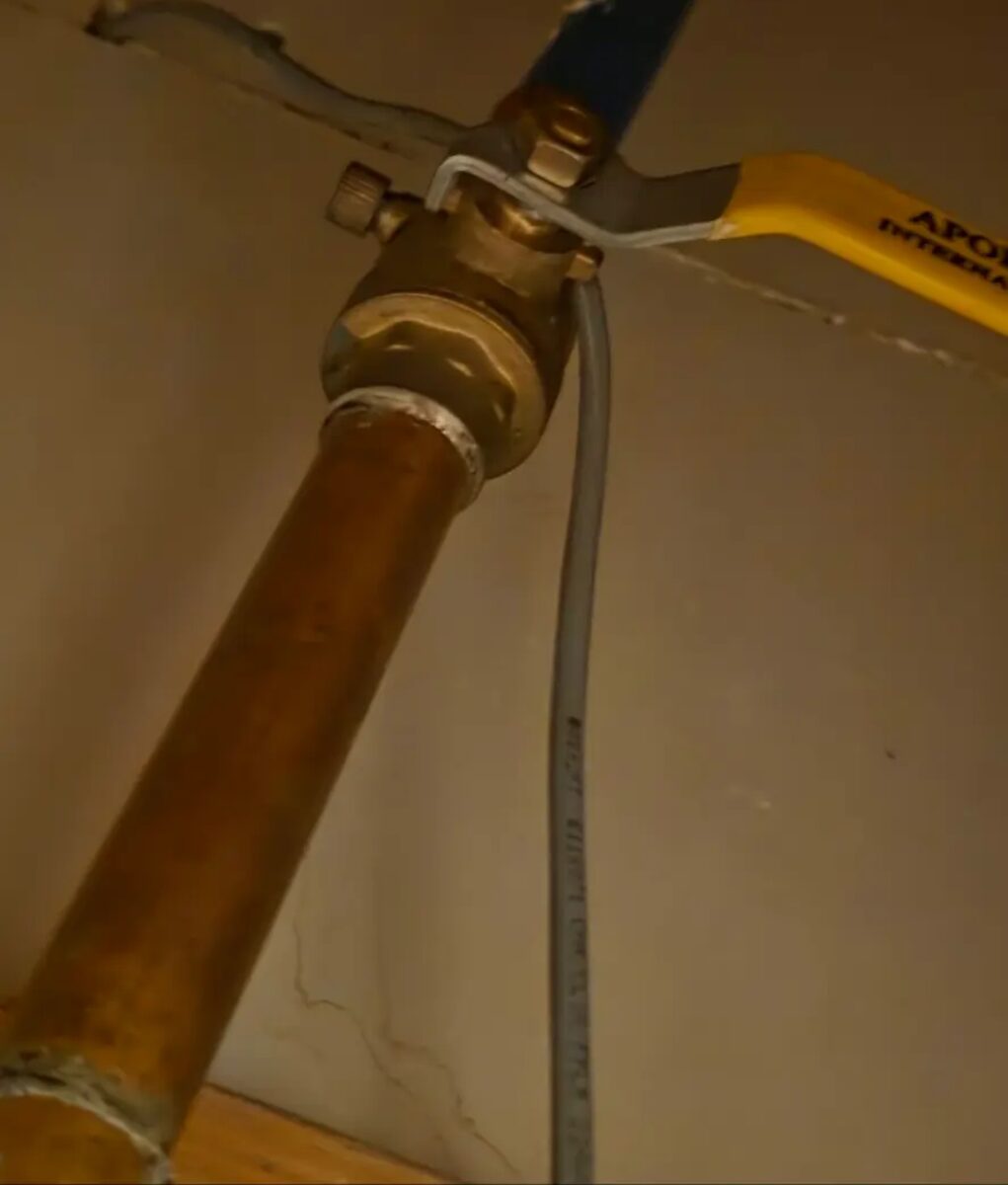 Interior shut-off and drain assembly serviced ahead of a backflow preventer installation.