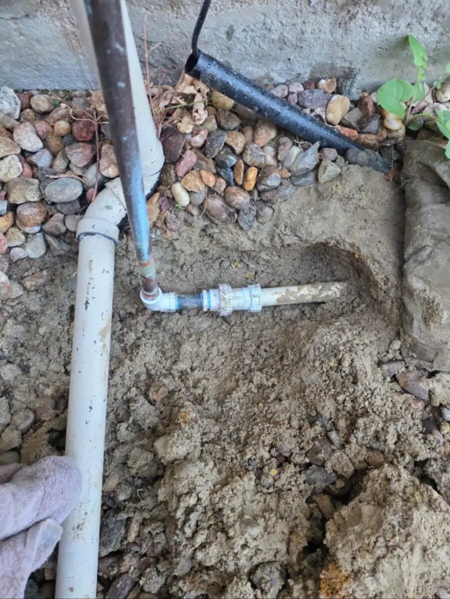 Main line coupling replaced at the foundation after a split was located and cut out.